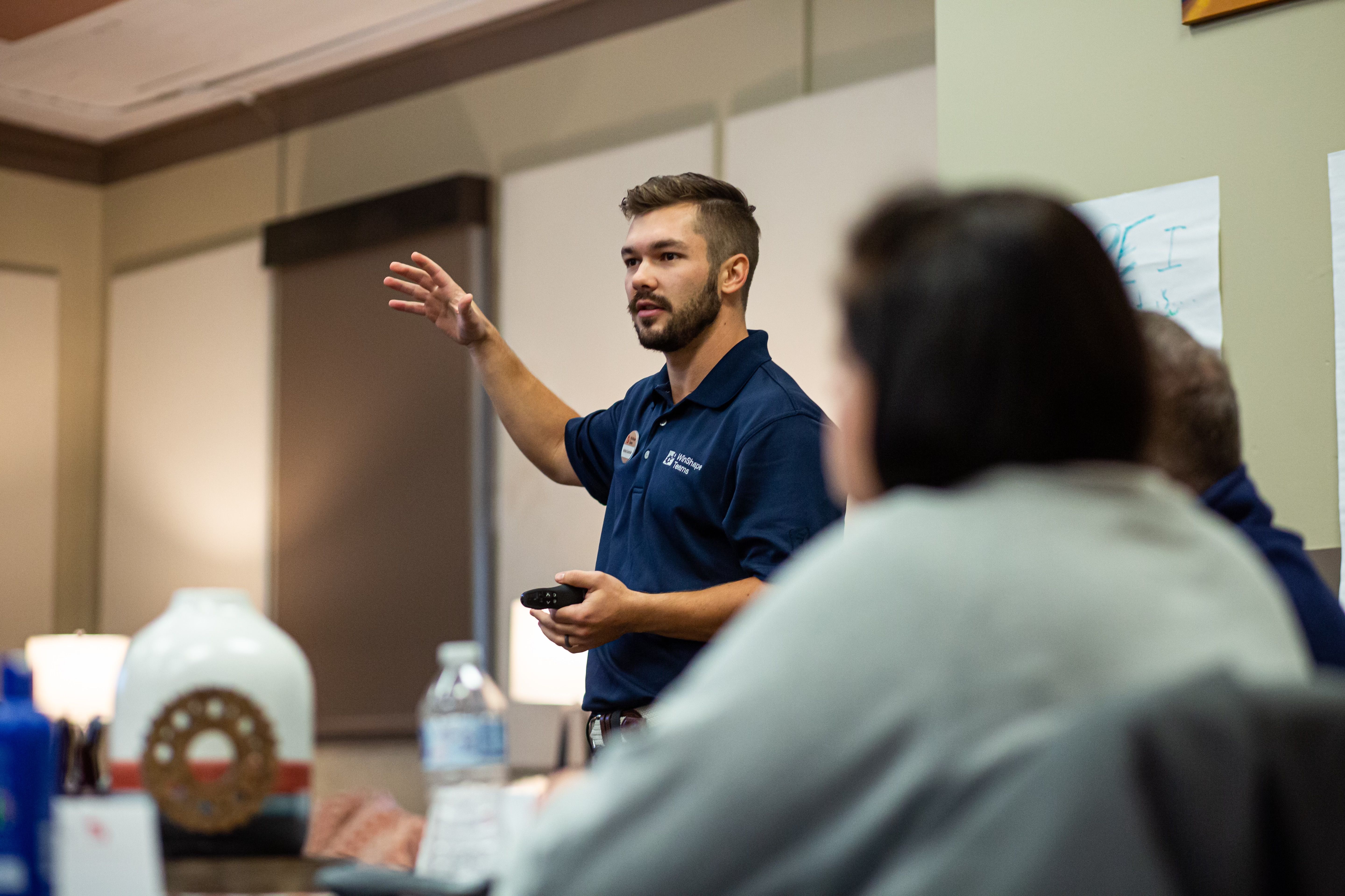 Nathan gesturing during a presentation